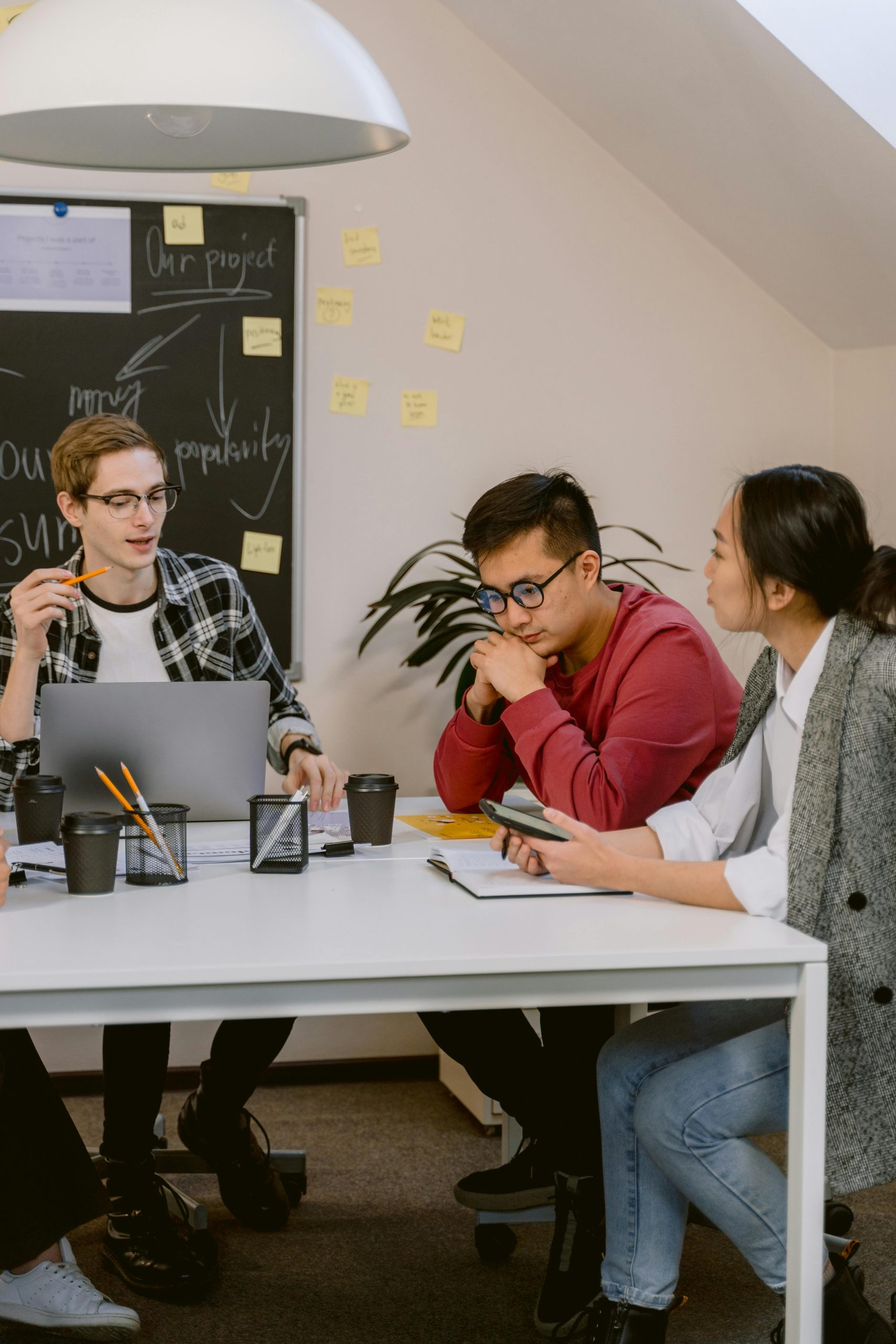 Image of a diverse group of young professionals having a discussion.