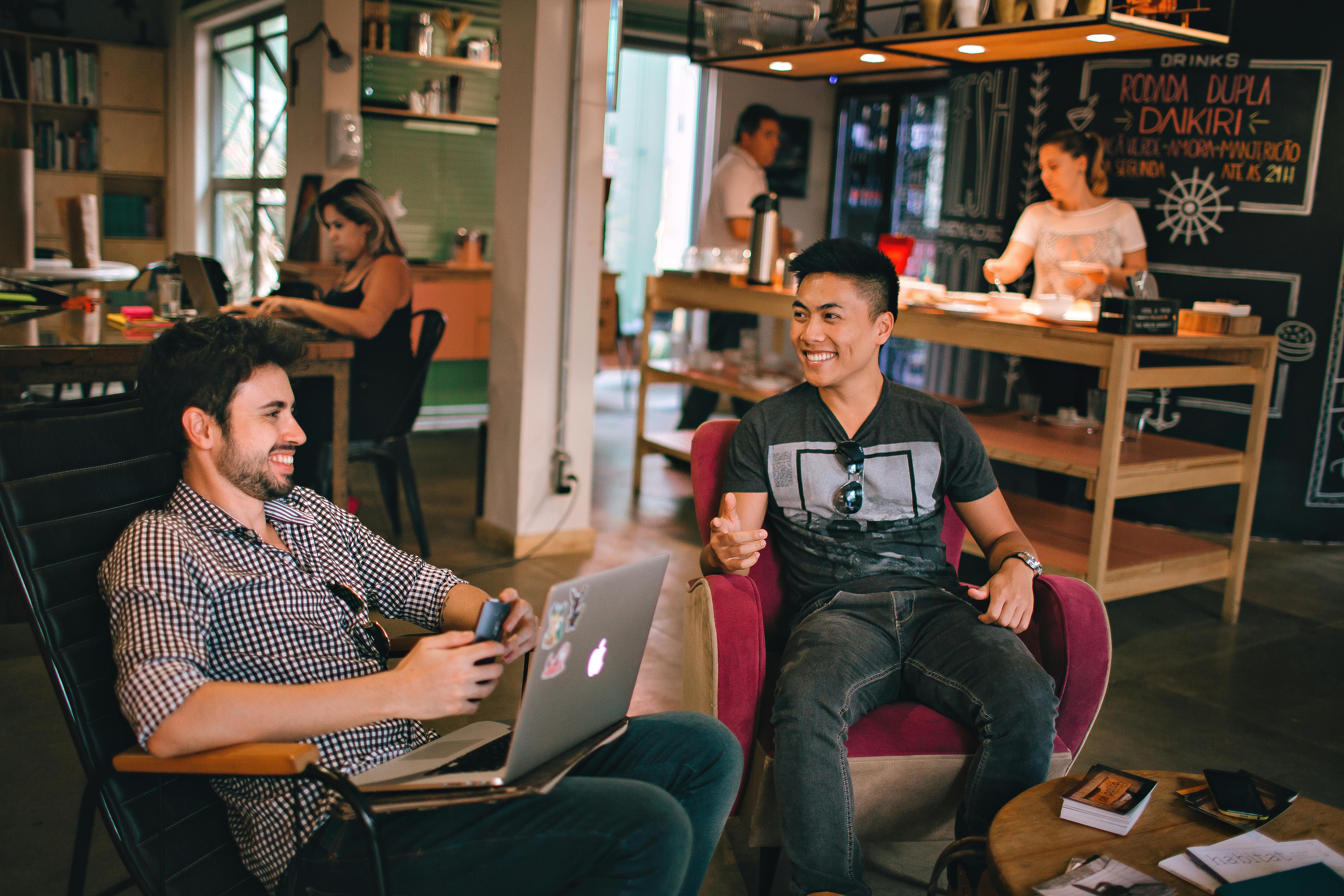 Image of two young men working at a coffee shop